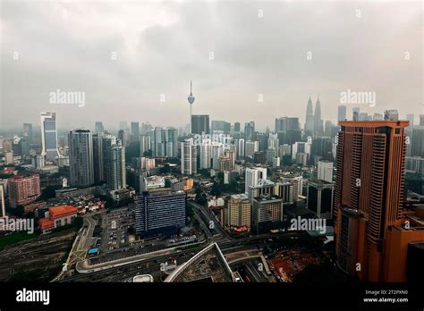 Kuala Lumpur: Portraits of a City – A Tapestry Woven With Urban Dreams and Concrete Reflections